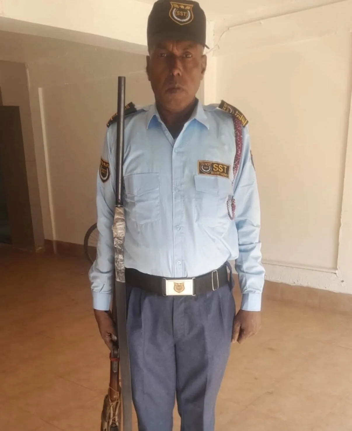 SST Security Agency armed guard in uniform